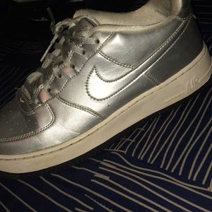 Silver and white Nikes
